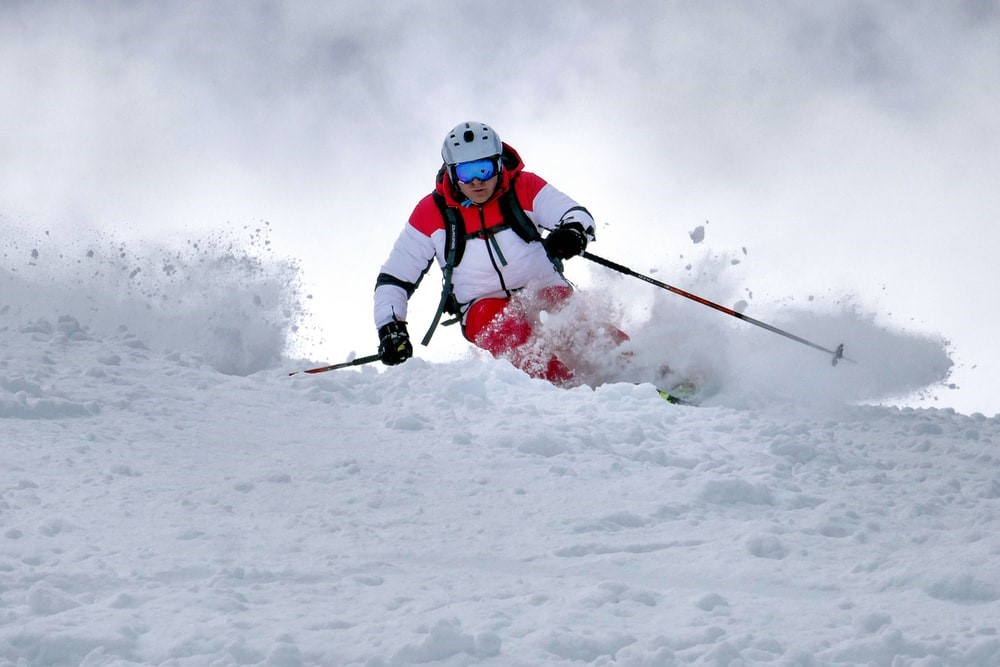man skiing on snow